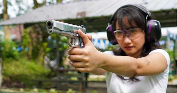 how should you hold a handgun for maximum accuracy?